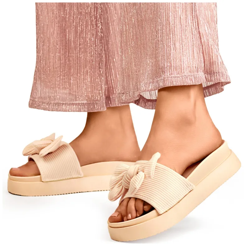Chaussons femme beiges avec noeud sur semelle épaisse